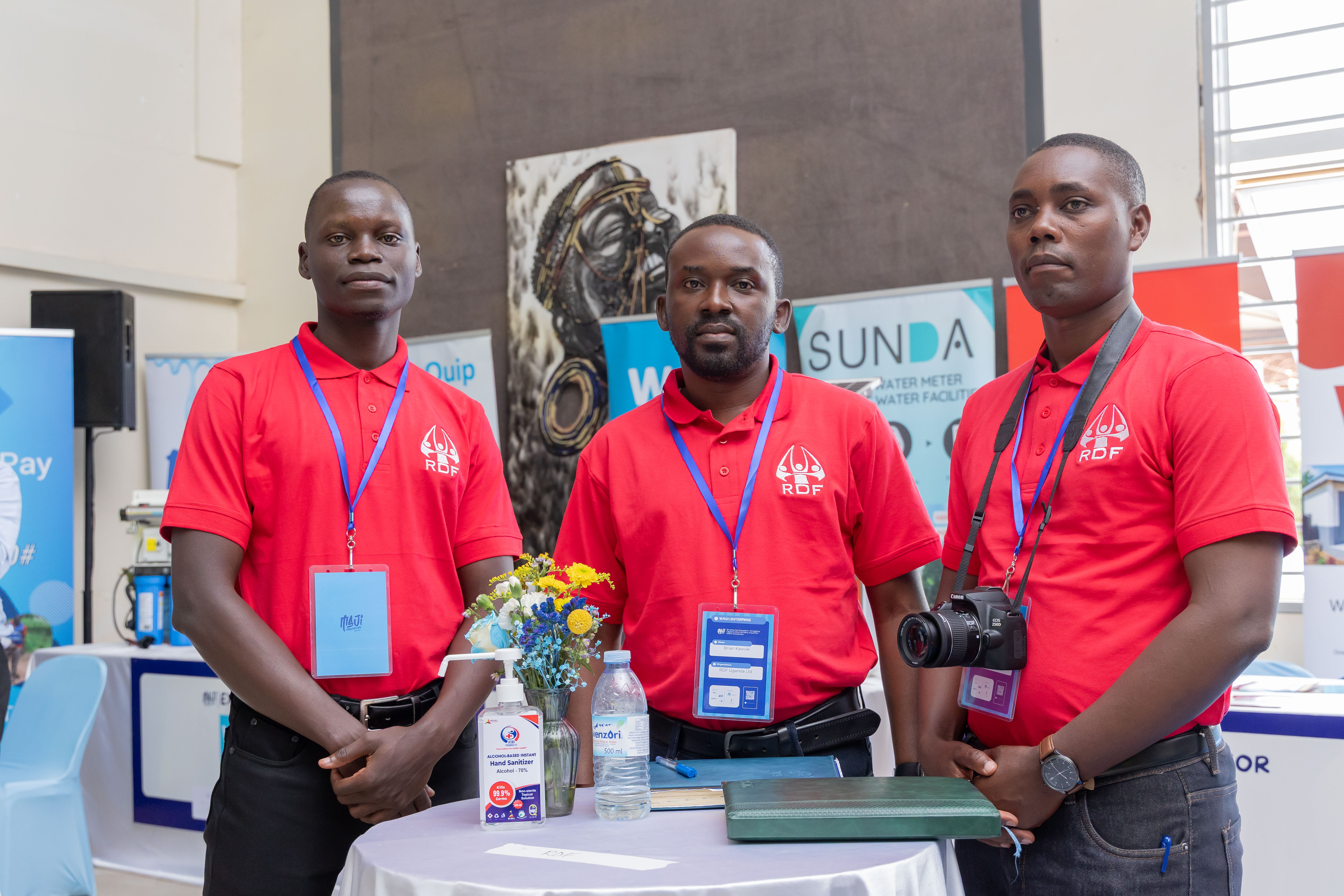 Three RDF Uganda staff members at the RDF exhibition booth during the Majipreneurs Summit 2026 marketplace
